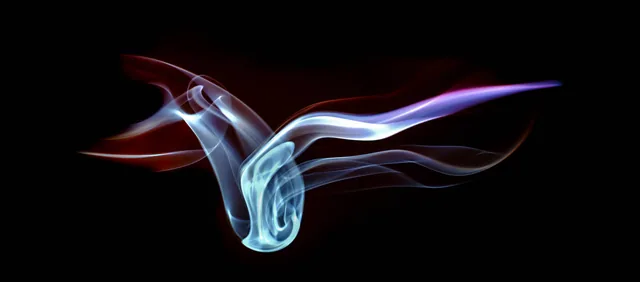 Pale blue and violet ribbons of smoke spread across a black background.